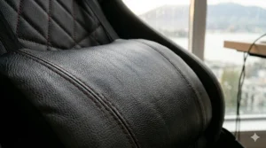 A detailed photorealistic close-up of an adjustable lumbar support pillow on a black and gray gaming chair, being adjusted by a hand.