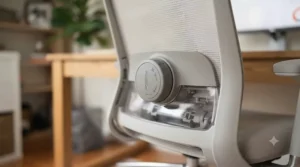 Detailed view of the built-in adjustable lumbar support on a petite-friendly ergonomic office chair.