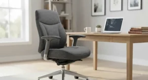 A comfortable grey fabric task chair paired with a minimalist wooden desk.